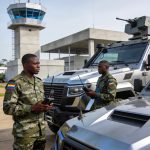 Create an editorial news illustration for an article about '65e anniversaire des FAC : le gouvernement réaffirme son engagement pour une défense moderne'. The specific country is Republique du Congo (Brazzaville) (CG); make visual cues accurate to th