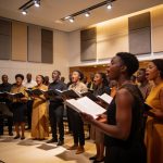 Create an editorial news illustration for an article about 'Concours des chorales : Brazzaville accueille la 8e édition du « Congo a du chœur » en juillet'. The specific country is Republique du Congo (Brazzaville) (CG); make visual cues accurate to