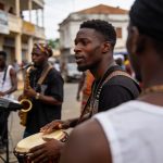 Create an editorial news illustration for an article about 'Festival Pointe-Noire en scène : la 11e édition met le cap sur les industries culturelles'. The specific country is Republique du Congo (Brazzaville) (CG); make visual cues accurate to this