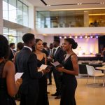 Create an editorial news illustration for an article about 'Pointe-Noire : le gala des bacheliers promet une 5e édition riche en orientation professionnelle'. The specific country is Republique du Congo (Brazzaville) (CG); make visual cues accurate t
