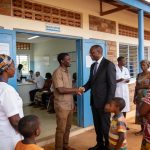 Create an editorial news illustration for an article about 'Poungou : le député Anicet Doumangoyi offre un centre de santé rénové aux populations'. The specific country is Republique du Congo (Brazzaville) (CG); make visual cues accurate to this exac